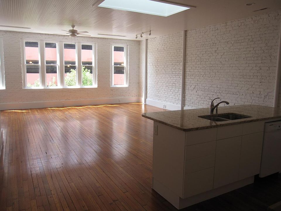living room windows, gorgeous original wood floors, and clerestory for lots of great light.