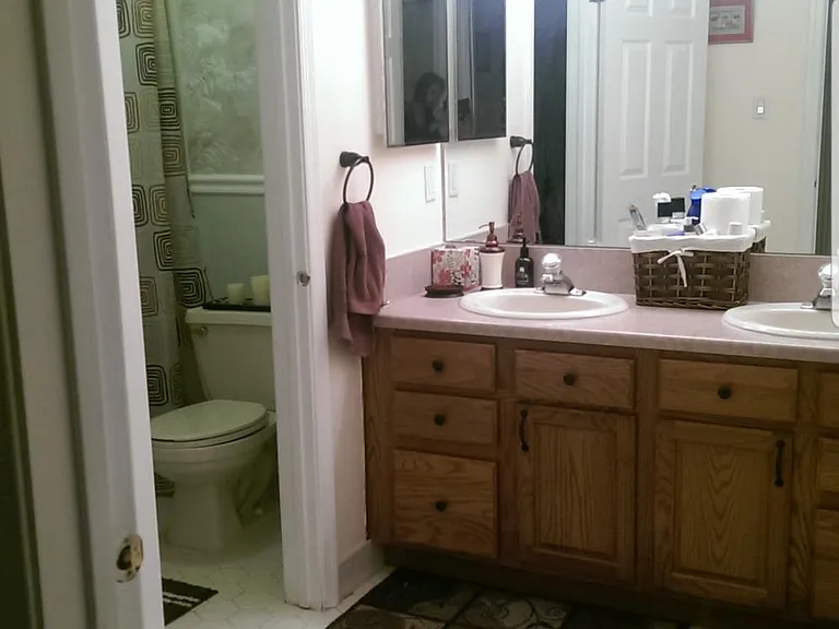 Bathroom has a split layout with dual sinks making it easy for multiple people to get ready in the morning