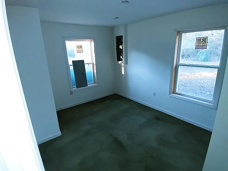 Each bedroom has big windows, plush carpet and large closets