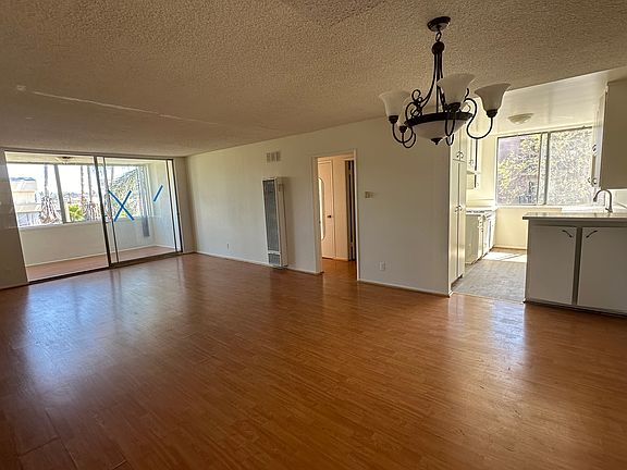 The unit interior overlookig the kitchen and enclosed patio