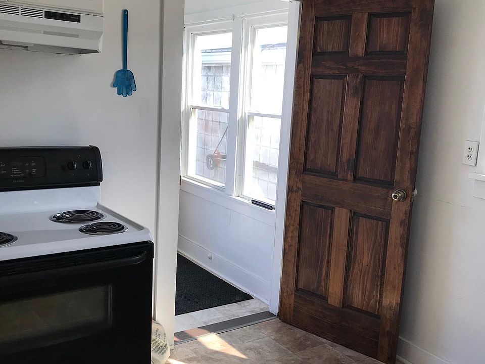 Kitchen view toward indoor porch area