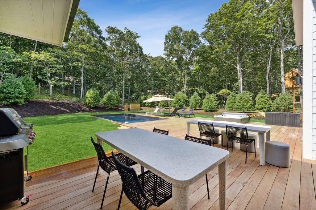 Spacious decking with hot tub and pool