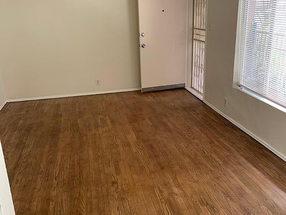 Spaceous Hardwood Floored Living Room