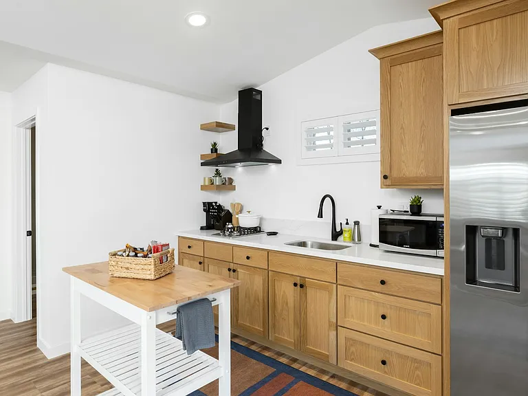 Kitchen equipped with your needs. Two stools were added to the center island for your comfort.