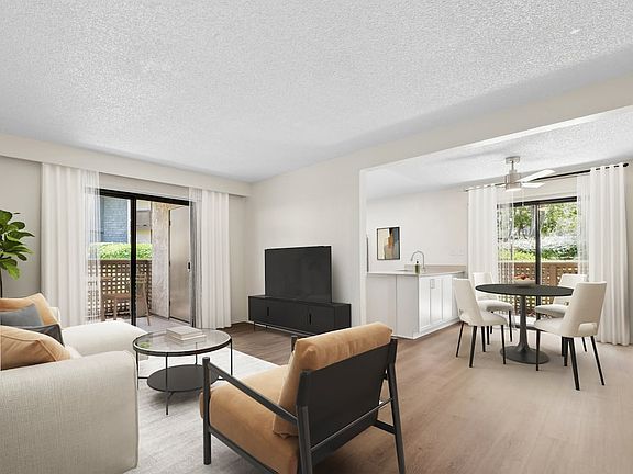 Renovated Package I living and dining room with hard surface flooring