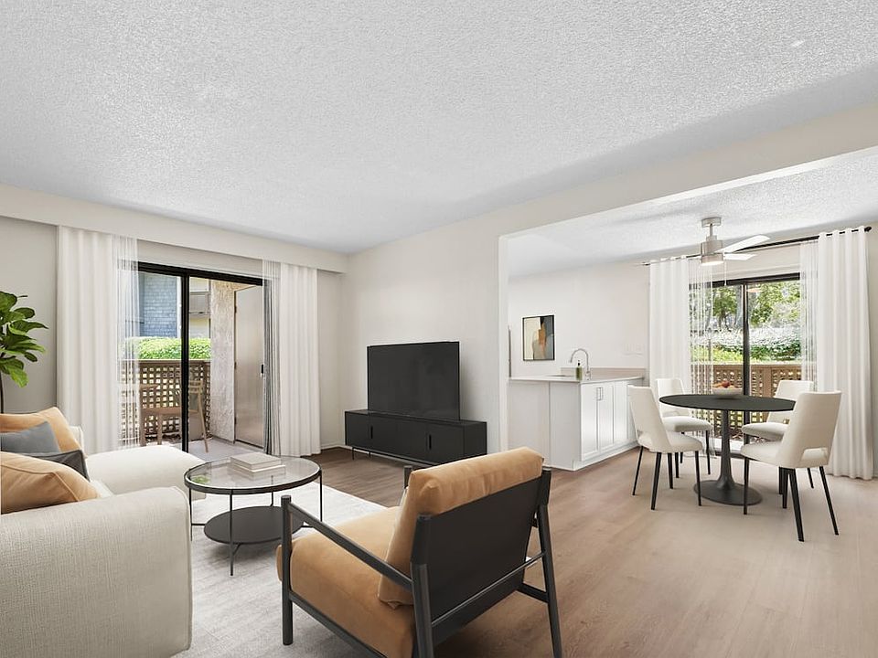 Renovated Package I living and dining room with hard surface flooring
