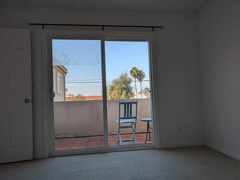 A view of the sliding glass doors leading to the balcony off your bedroom.