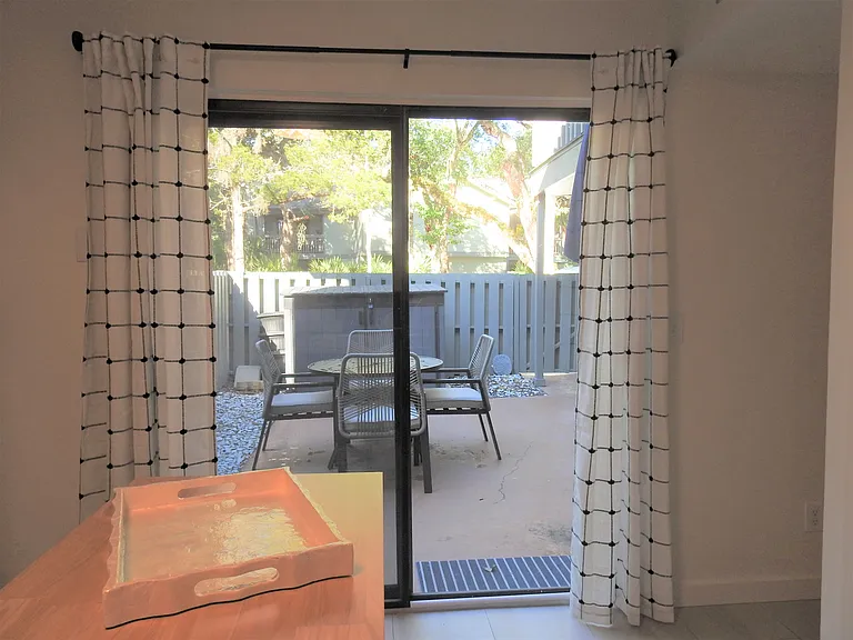 View from kitchen out to patio. brand new easy glide slider for those private dinners al fresco