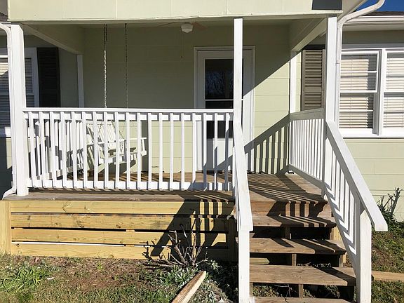 Front porch with swing and ceiling fan. 11'6" x 8'
