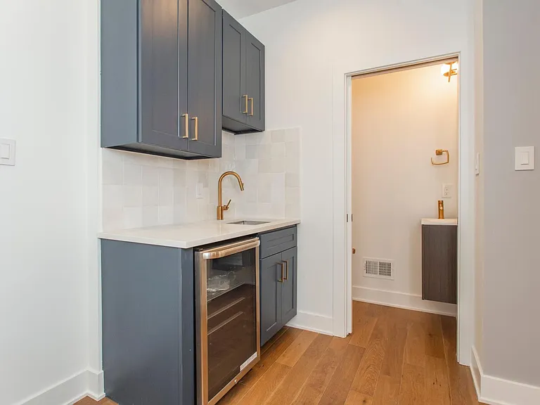 Wet Bar and half bath leads to roof deck!