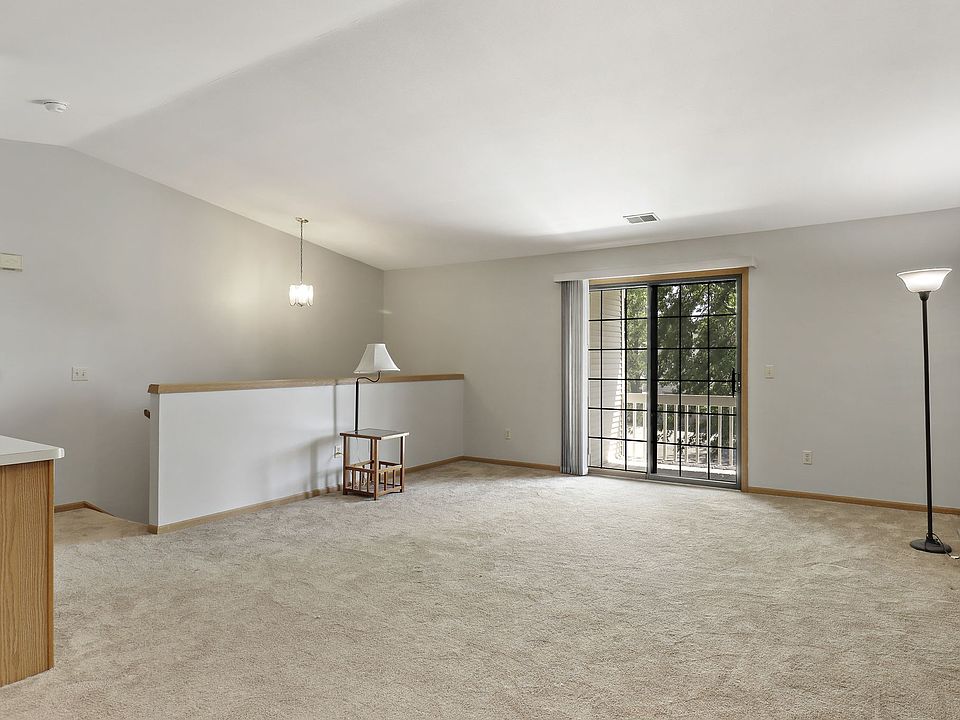 Living Room with Arched Ceilings and Sliding Glass Doors that lead to Private Deck.