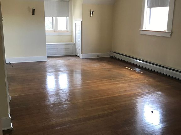 Gorgeous hardwood floors and wonderful natural light! Window seat with window nook with storage and three storage spaces in the eaves.