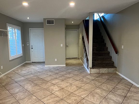 From left to right: Front door, Door to Garage, Stairs