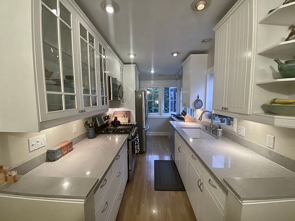 Kitchen with new quartz countertops and a new sink/faucet