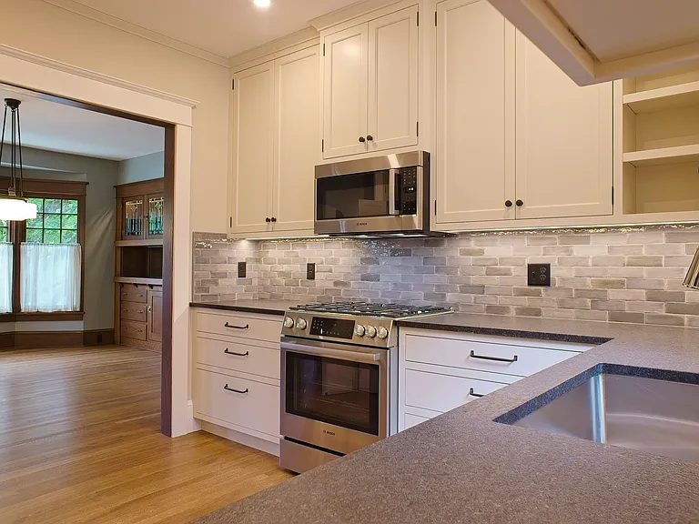 Modern kitchen remodel with custom cabinets, new Bosch appliances.