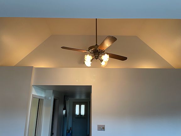 Large Livingroom with cathedral ceiling , accent lighting, ceiling fans