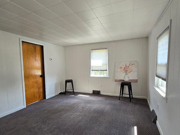 Room 15' 7 ' X 11' 3" Carpet is medium gray.