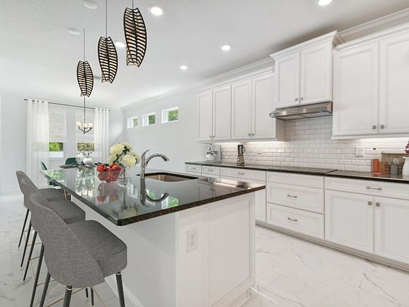 Jupiter new construction home plan kitchen in Riverview, FL at River Pointe by William Ryan Homes Ta