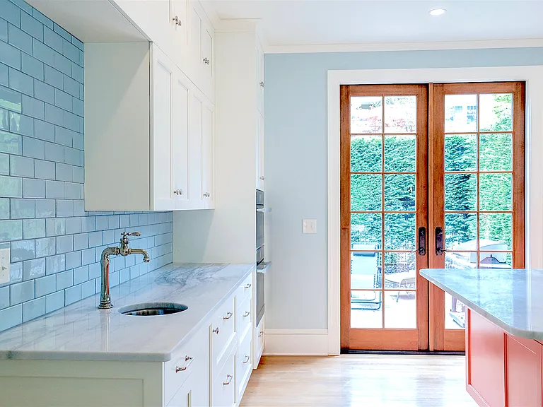 French doors in kitchen to front patio. Lots of light.
