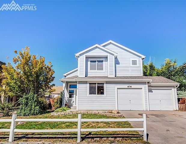 Welcome home! Beautiful treed front with white picket fence!