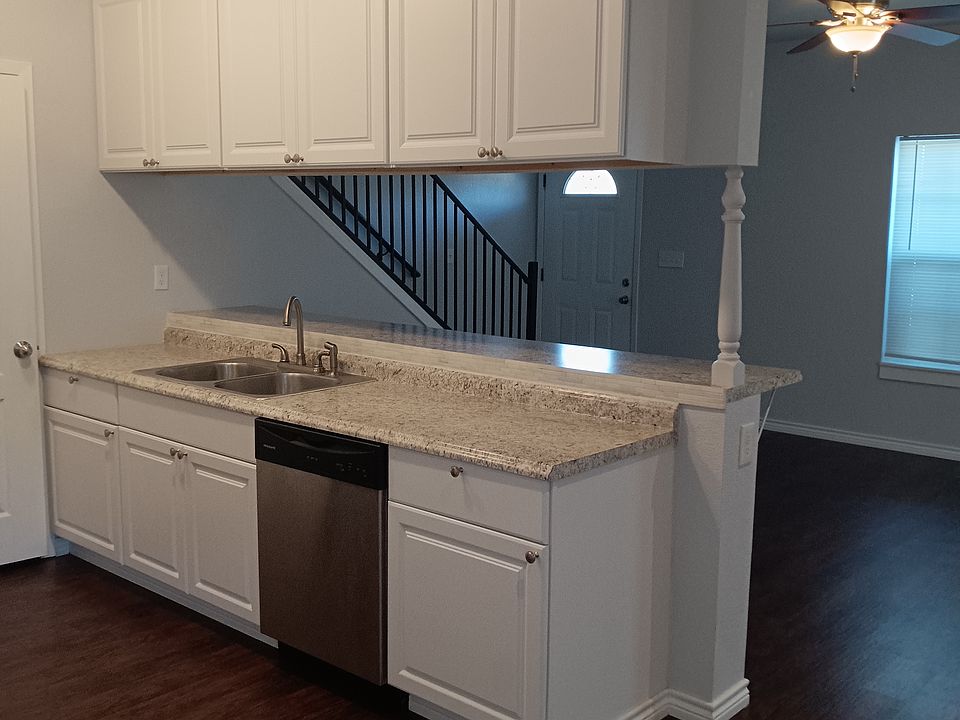 Open concept with kitchen opening into living area.