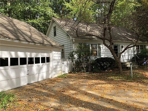 Notice the concrete driveway!