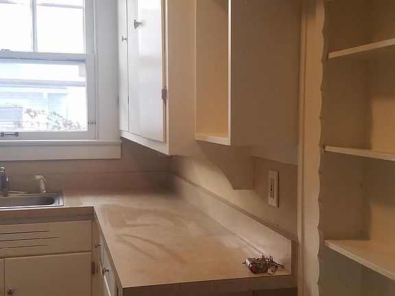 Kitchen showing cute built in shelves.