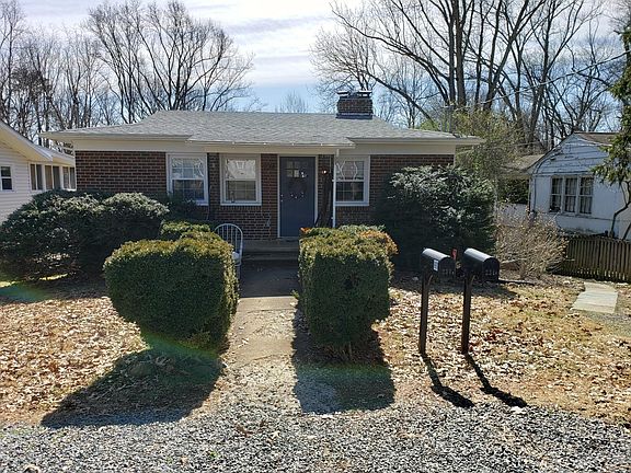 Front of house. Rear entrance to the unit is along a path to the right of the photo. Driveway parking for 1 car.