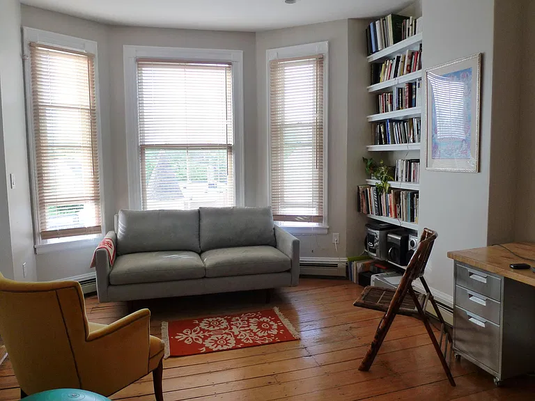 Living Room with bay window and built-in bookshelves