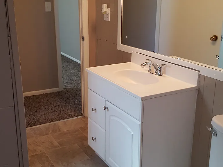 Bathroom connects to hallway and bedroom #3