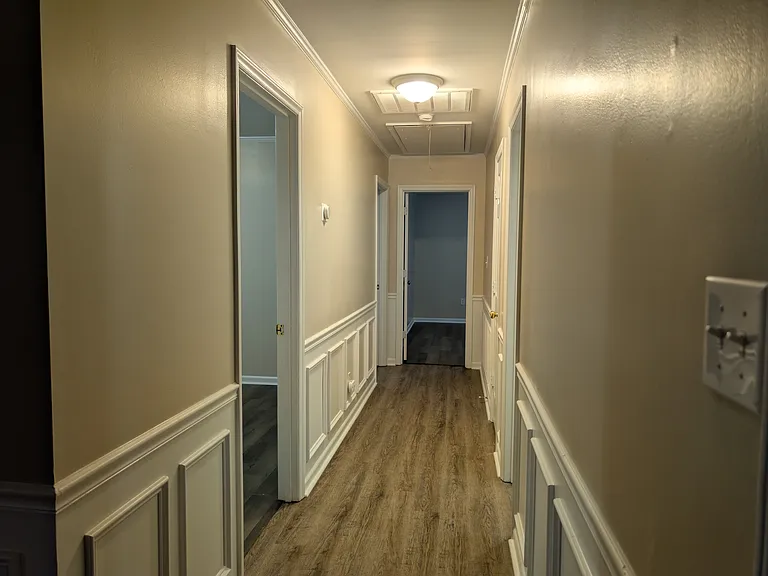 Hall way. Bedroom1 first left, bedroom 2 second, master at end of hall and bathroom on right in middle of hall