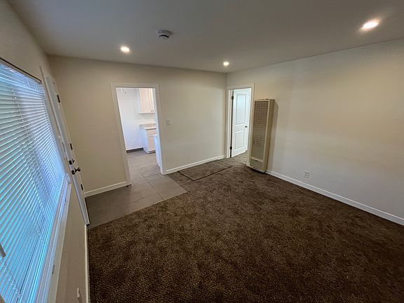 Living Room with new carpet and recessed lighting