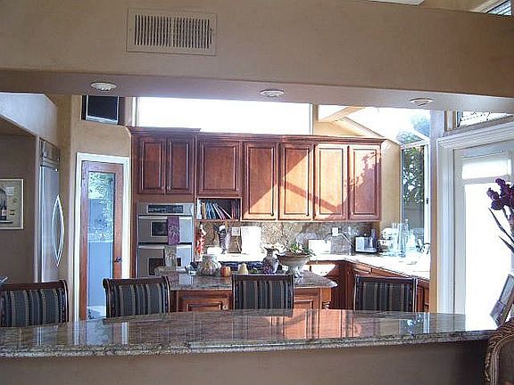 granite, Viking appliances, view of fireplace