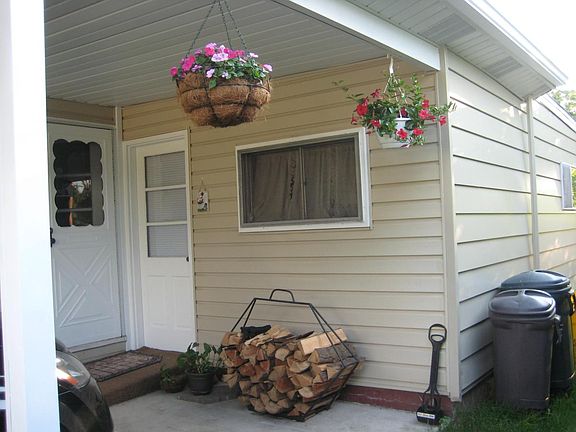 car port, side door, & side shed