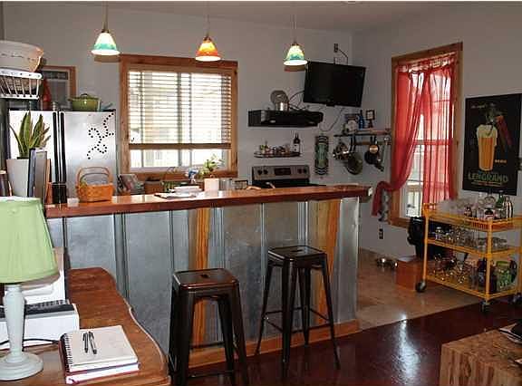 Living/dining/kitchen area with breakfast bar