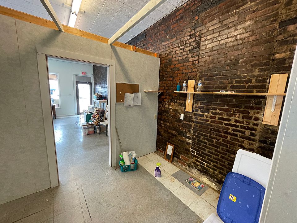 Behind the wall. This was previously used as office space and storage.