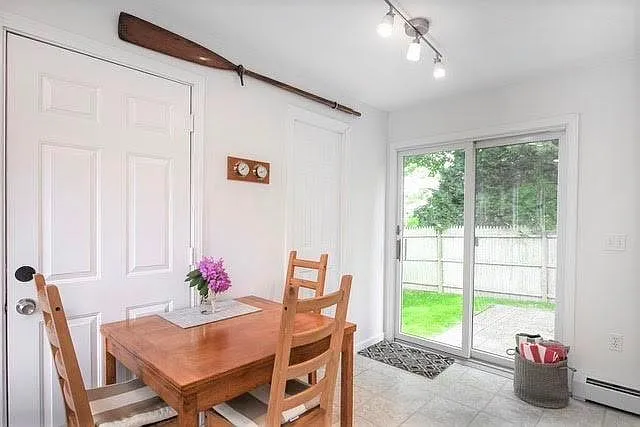 Eat-in kitchen with new 1/2 bath next to sliders to patio.