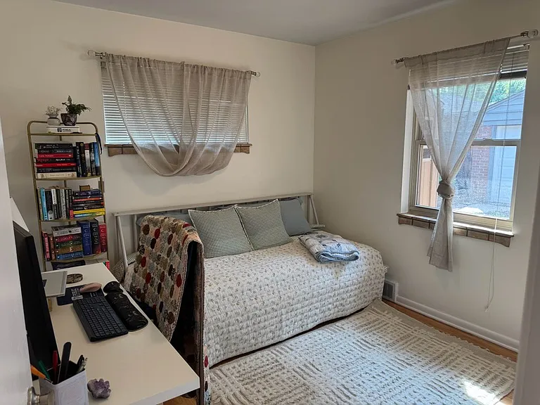 Second bedroom or home office with view of the garden.