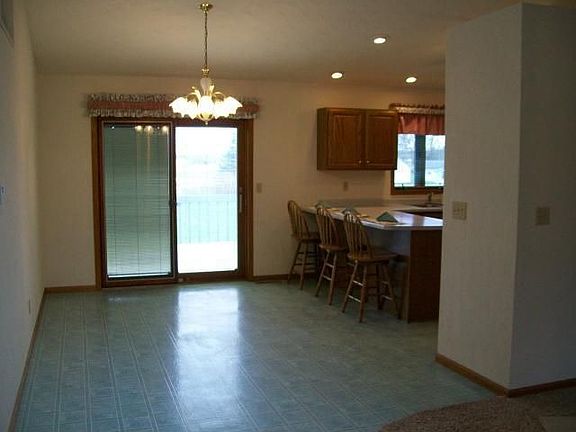 Dining room with sliders to decks, overlooking 1+ acres