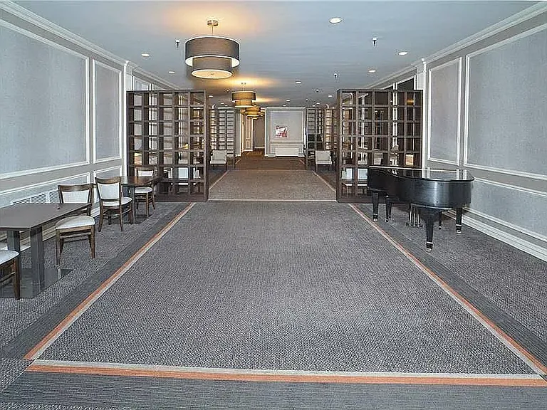 Downstairs lobby and elevators. Building provides doorman service, security camera service, and a secure package room.