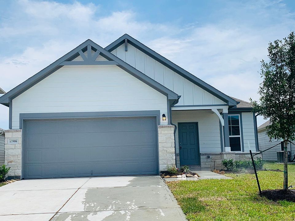 A quaint fairly new house with covered porch, large backyard, in a quiet neighborhood with walking trails, community pool & playground for kids.