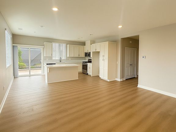 Great Room and Kitchen and direct access to Balcony.