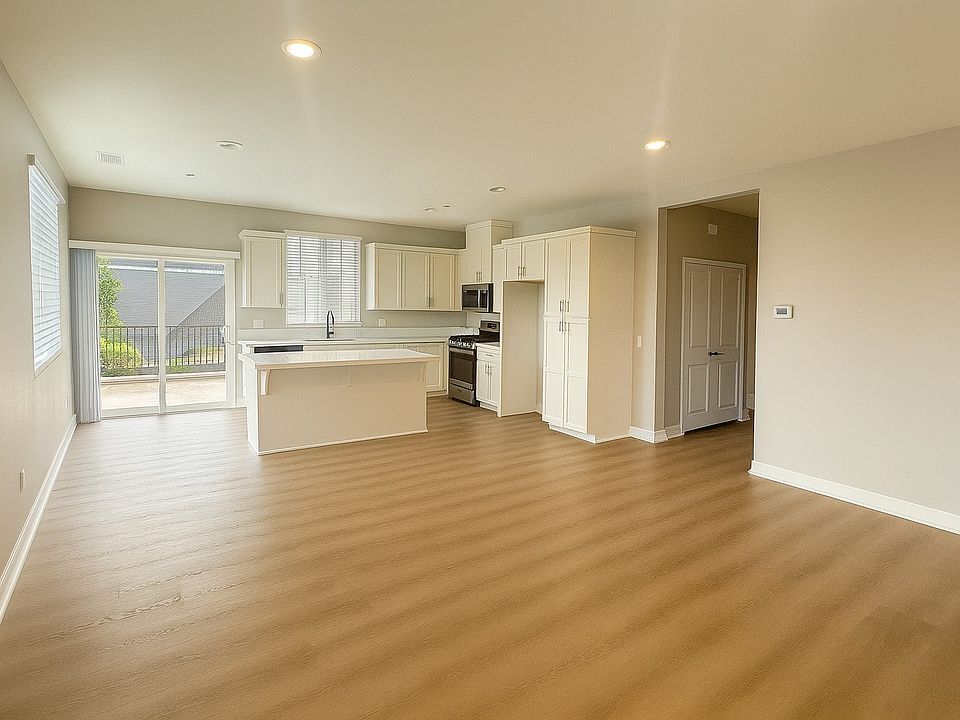 Great Room and Kitchen and direct access to Balcony.