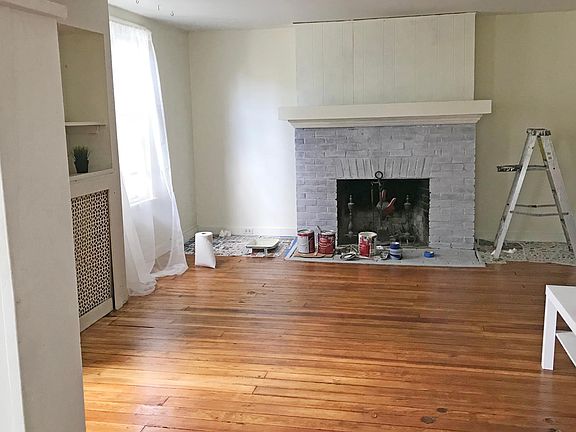 Living room- final coat of fresh paint on fireplace underway