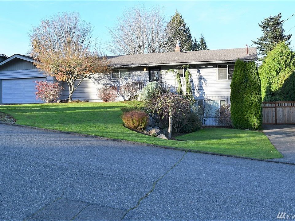 Living and two car garage on the main. Secondary driveway goes almost the full length of the property.