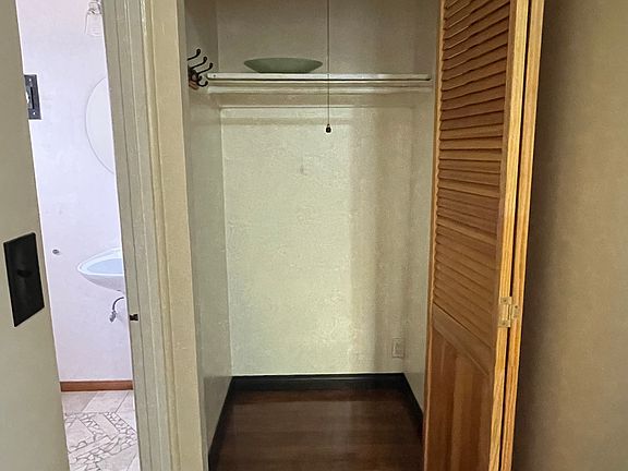 Closet, with bathroom entry to the left