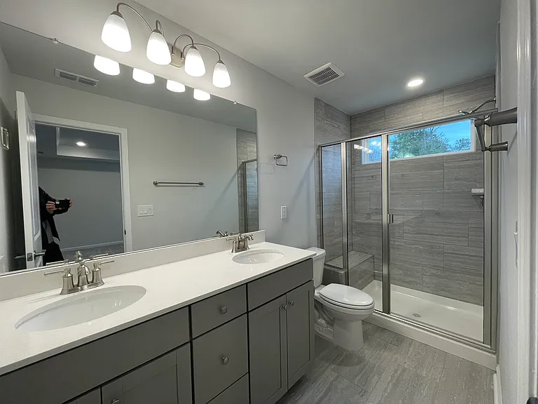 Private en-suite bathroom with dual sinks