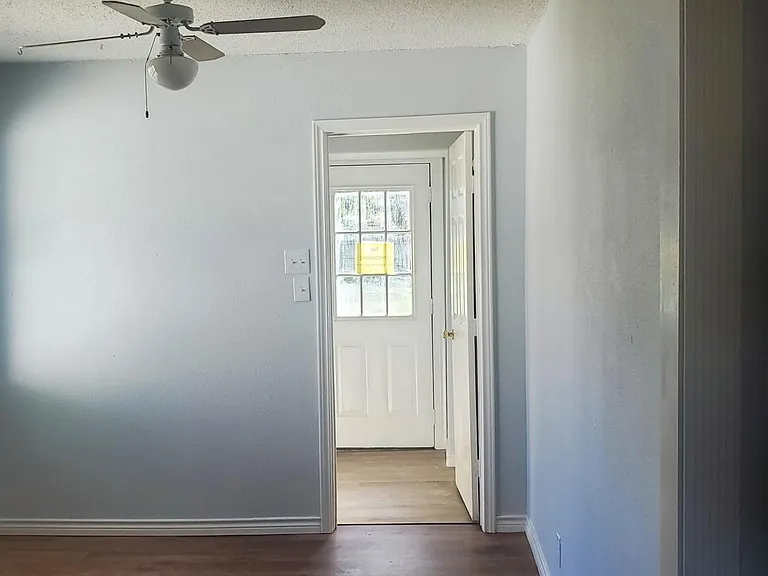Dining area into laundry room with back door to outside