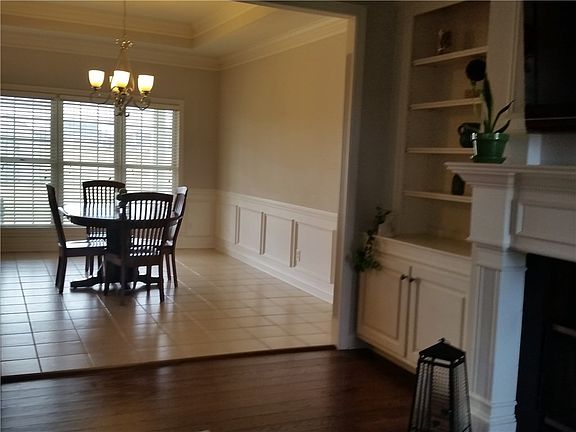 Dining Room with crown molding & wainscot