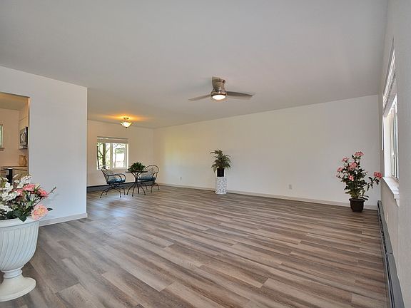Spacious open concept living room with coat closet.